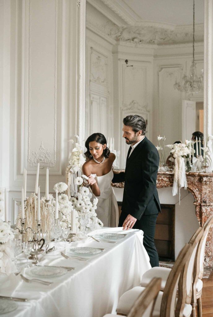 Chateau de Ferrieres Avecamour bride groom checking reception table vintage room