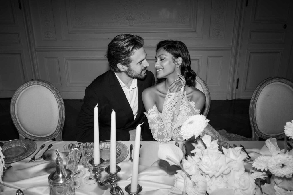 Chateau de Ferrieres Avecamour bride groom sitting looking each other reception table black white photo