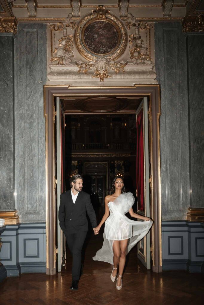 Chateau de Ferrieres Avecamour bride groom walking holding hands vintage gold room