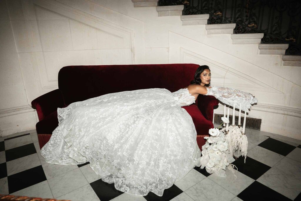 Chateau de Ferrieres Avecamour bride lying down vintage red sofa lace dress