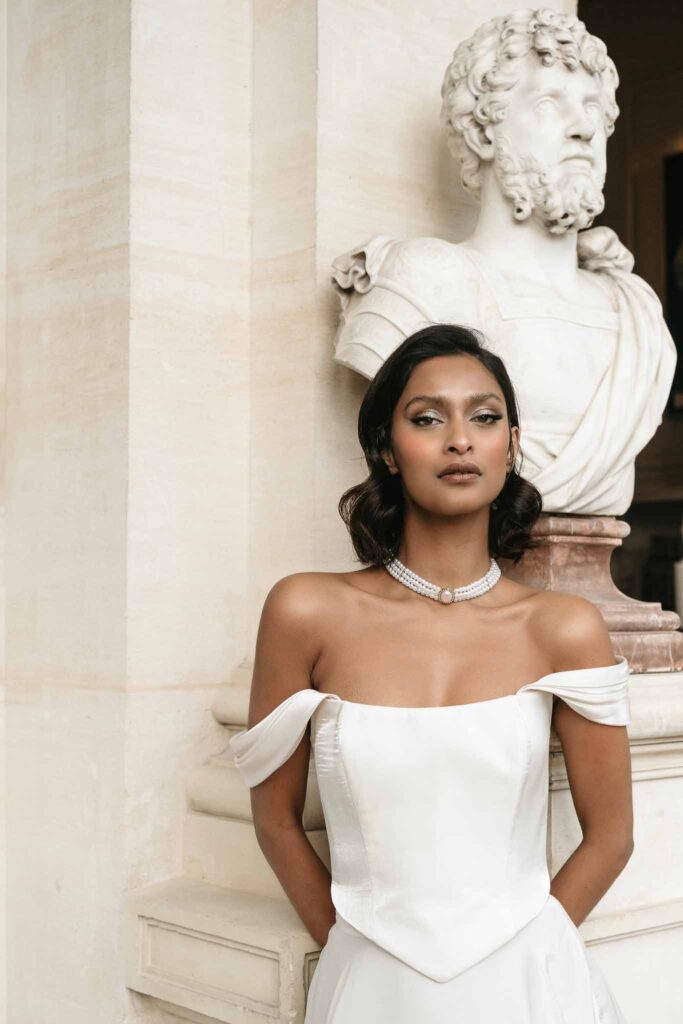 Chateau de Ferrieres Avecamour bride off shoulder corset dress head stone background