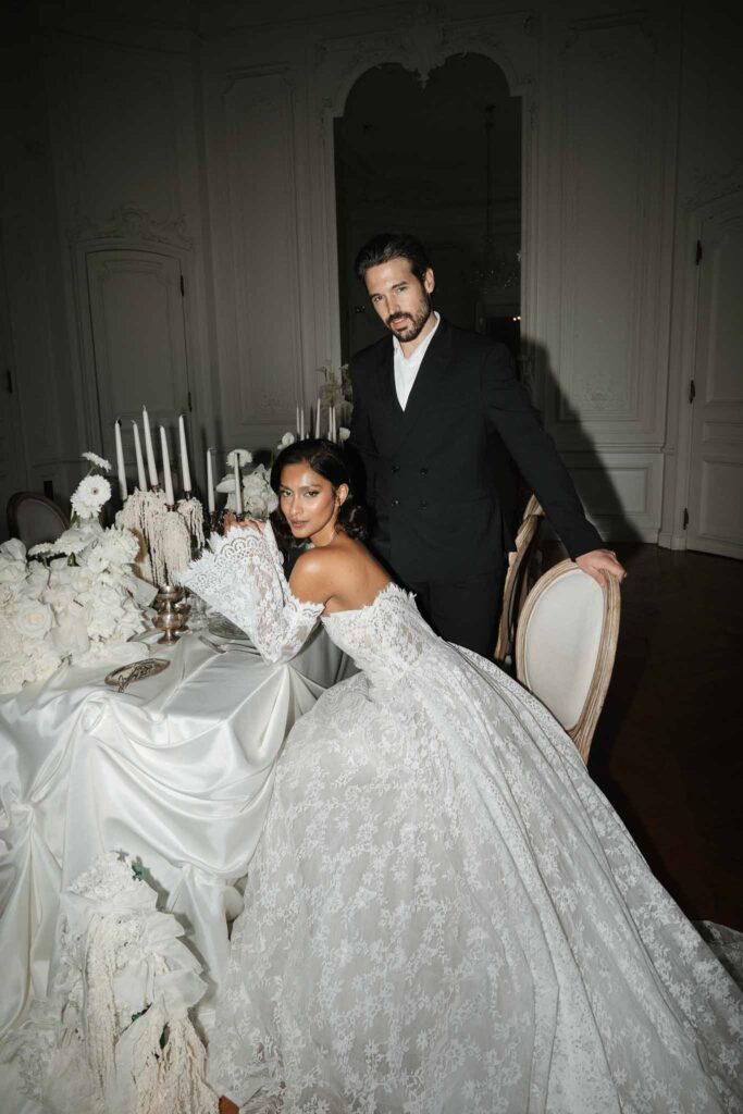 Chateau de Ferrieres Avecamour bride sitting groom standing reception table big lace ball gown