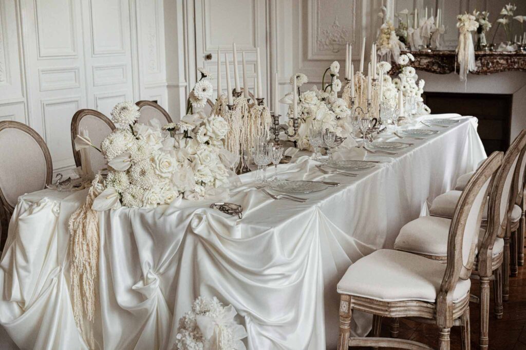 Chateau de Ferrieres Avecamour detail shot long reception table white vintage chair room