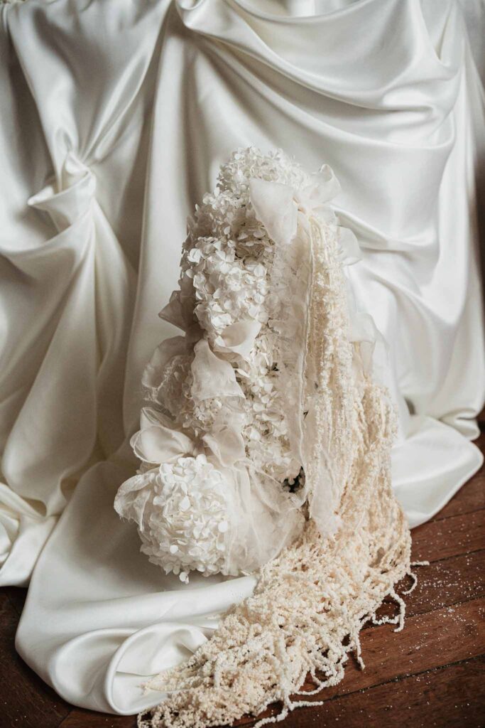Chateau de Ferrieres Avecamour detail shot white flowers pearls cloth draping table