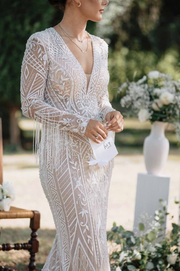 Chateau de Maillac Ala Breskaya detail shot bride lace fringe deep v longsleeves dress