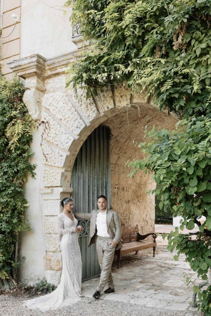 Chateau de Maillac Ala Breskaya groom brown gray tuxedo hands wall bride leaning wall garden