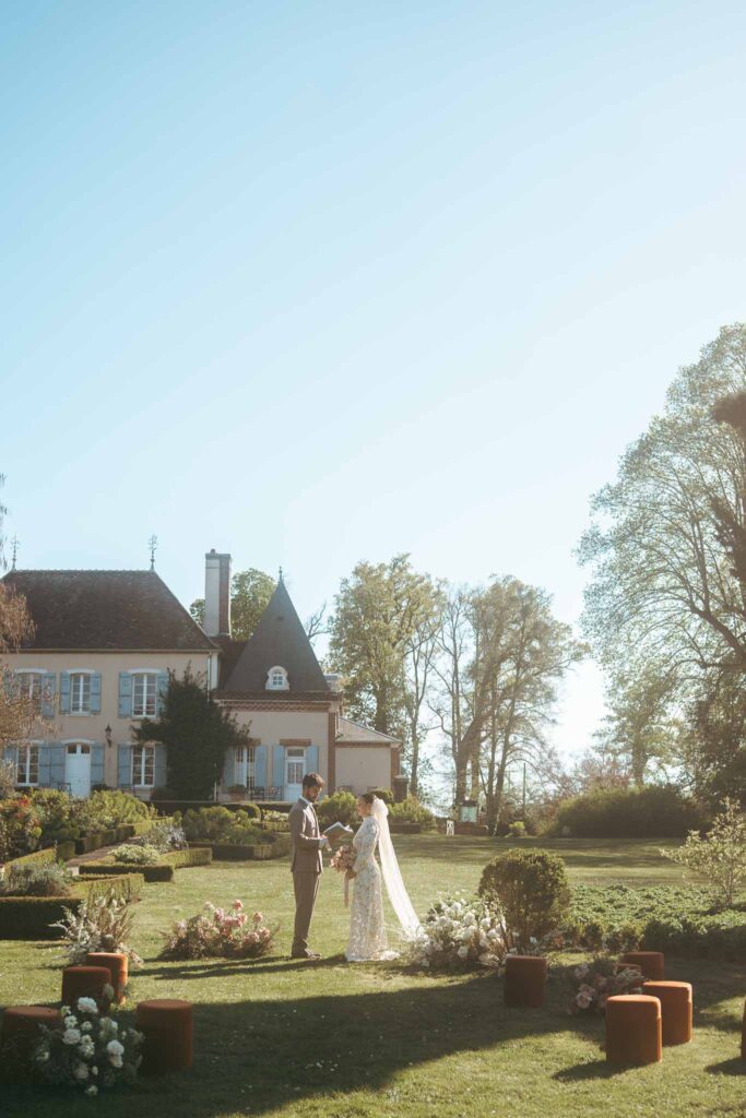 Chateau de la gruerie bride groom reading vows ceremony altar garden