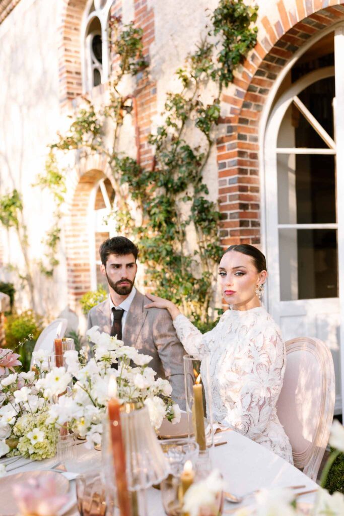 Chateau de la gruerie bride groom sitting reception table garden
