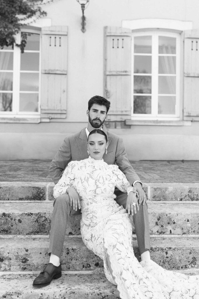 Chateau de la gruerie bride groom sitting stairs black white photo