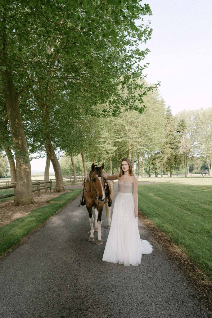 Chateau sainte claire keith flament bride strapless dress gardn holding horse