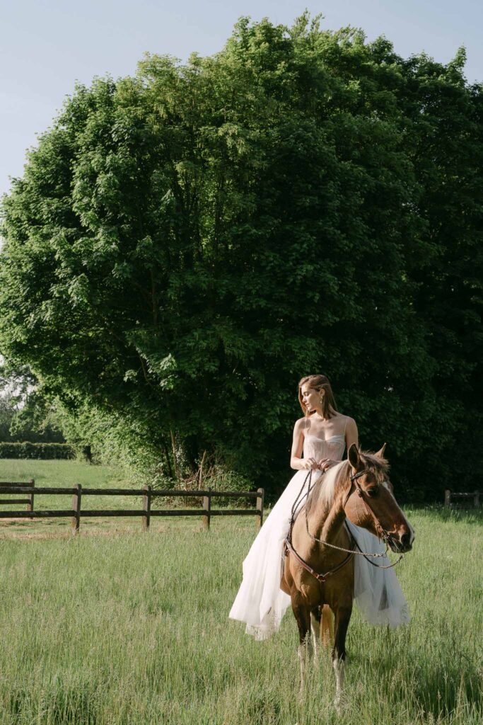 Chateau sainte claire keith flament short hair bride flowy dress riding horse field
