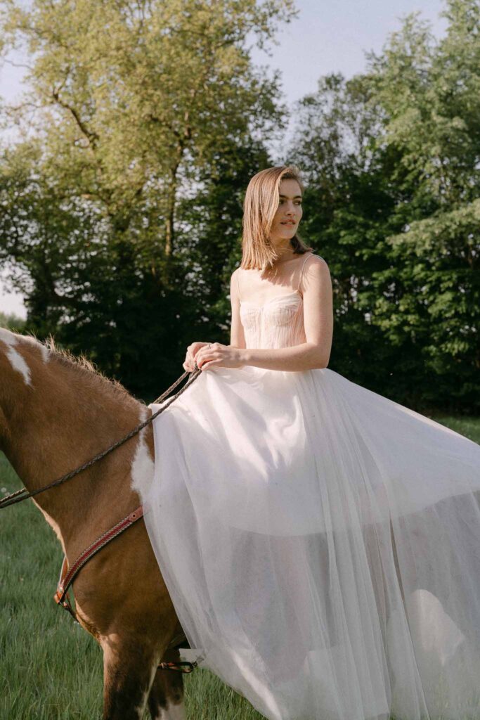 Chateau sainte claire keith flament short hair bride flowy dress riding horse field sunset