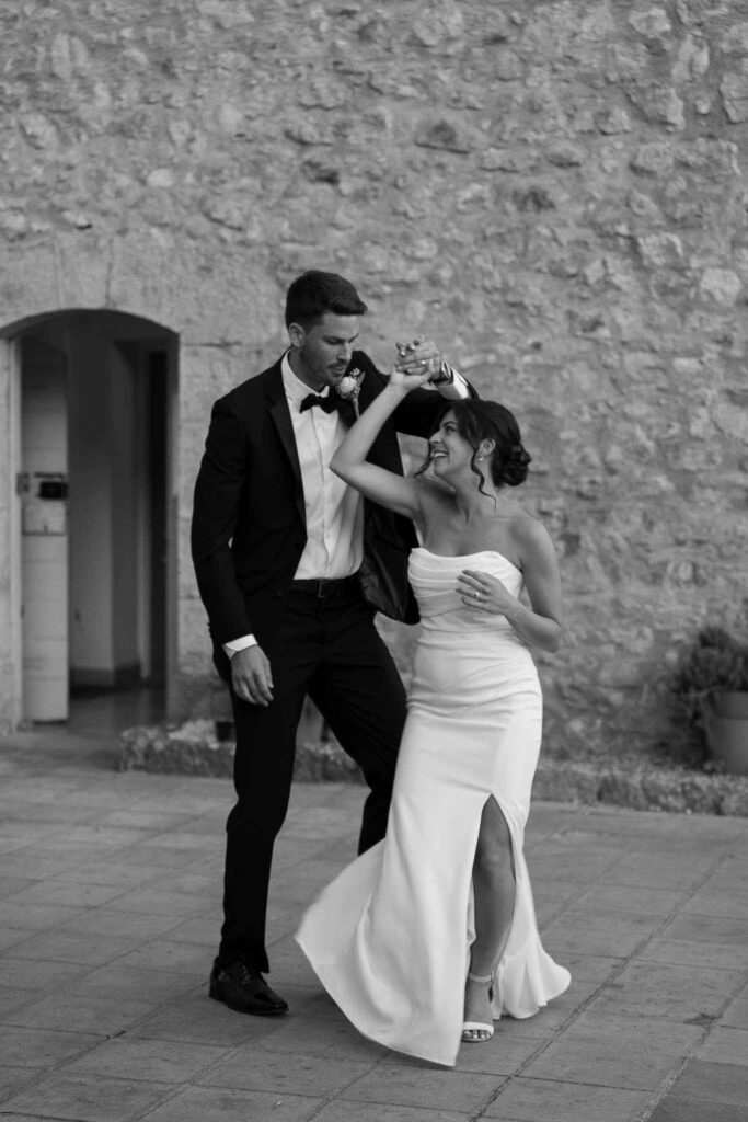 manoir de letang myrto events bride groom dancing twirling black white photo