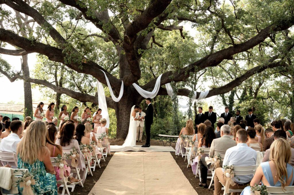 manoir de letang myrto events bride groom standing ceremony proper wide shot