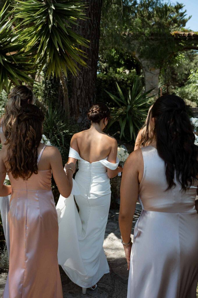 manoir de letang myrto events bride off shoulder dress low bun hair bridesmaids