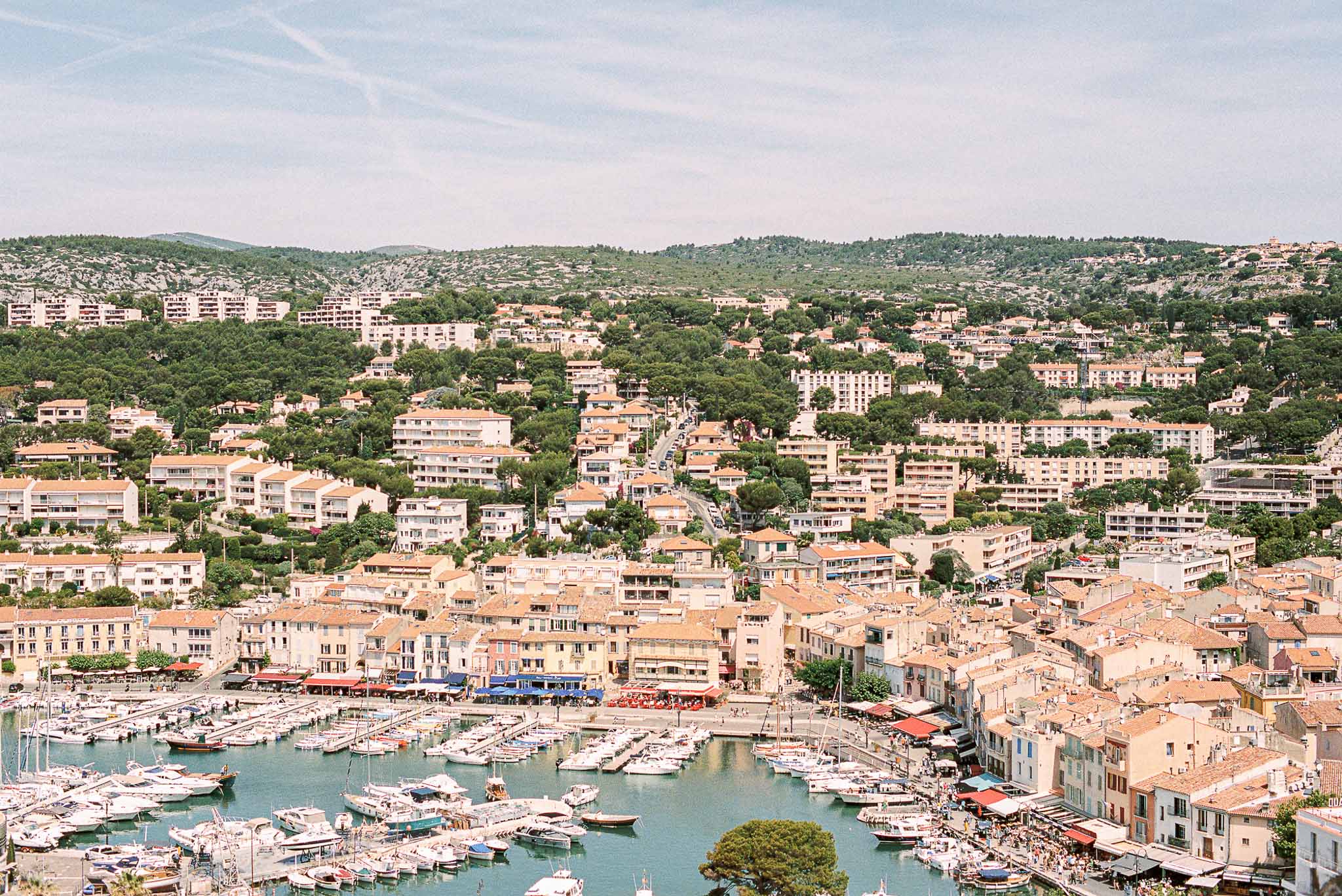 Chateau Cassis Olya aerial shot venue lake boats buildings trees