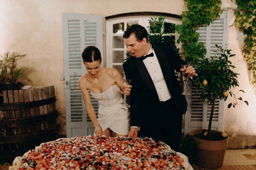 Chateau de Robernier Elise Morgan bride groom cutting cake reception night