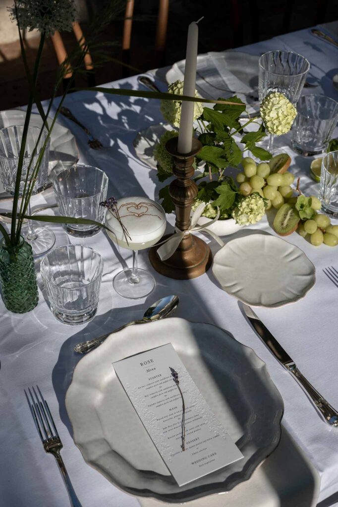 MCaelicia Galinier Lourmarin detail shot long reception table glasses