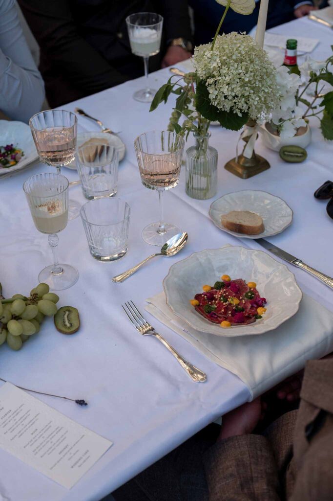 MCaelicia Galinier Lourmarin detail shot long reception table plate food