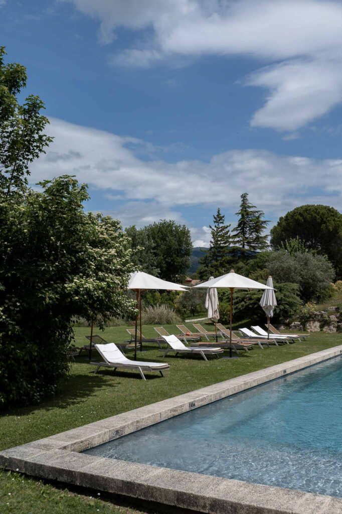 MCaelicia Galinier Lourmarin detail shot venue pool area lounge chairs sun