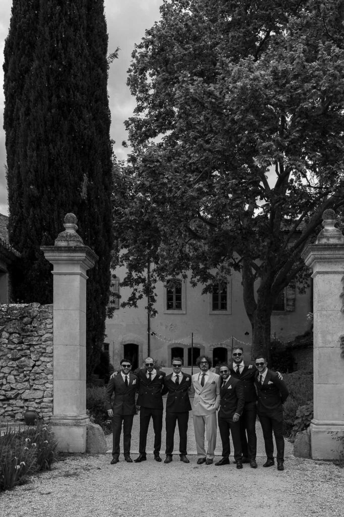 MCaelicia Galinier Lourmarin groom groomsmen get ready garden black white photo
