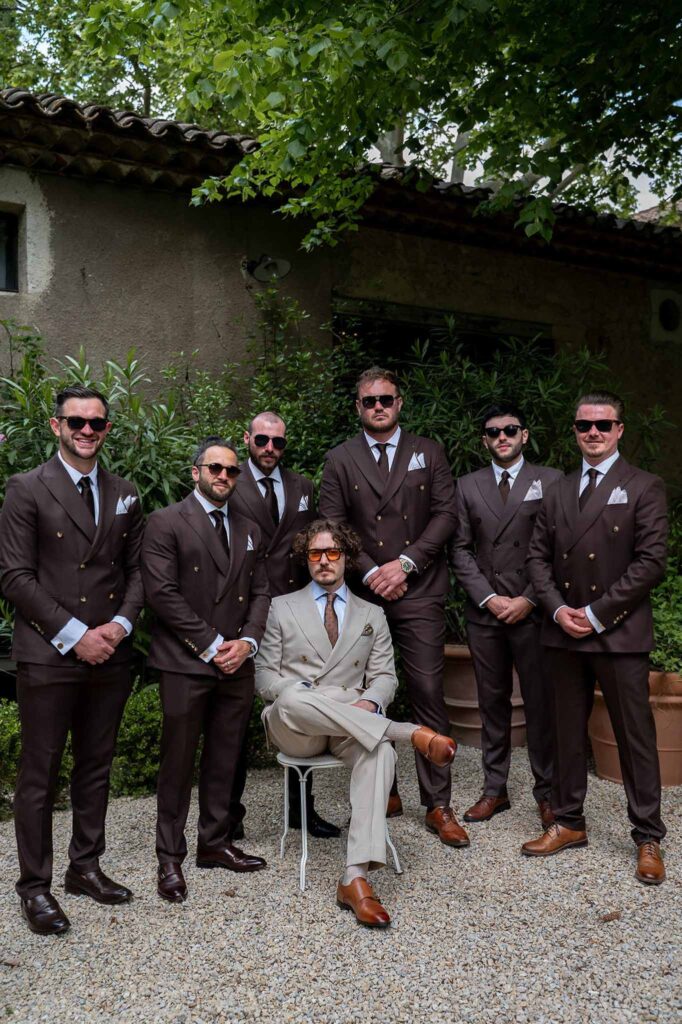 MCaelicia Galinier Lourmarin groom groomsmen get ready outside tuxedo brown shoes