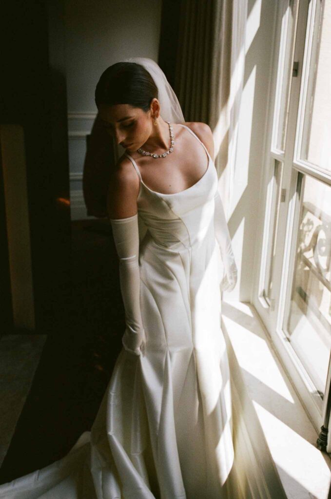 Boat in Paris Joan Jellet bride get ready halter mermaid dress window