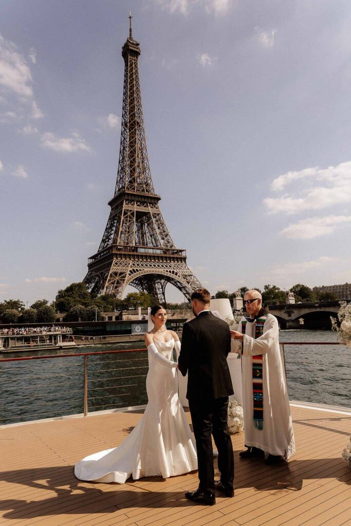 Boat in Paris Joan Jellet bride groom ceremony altar boat holding hands