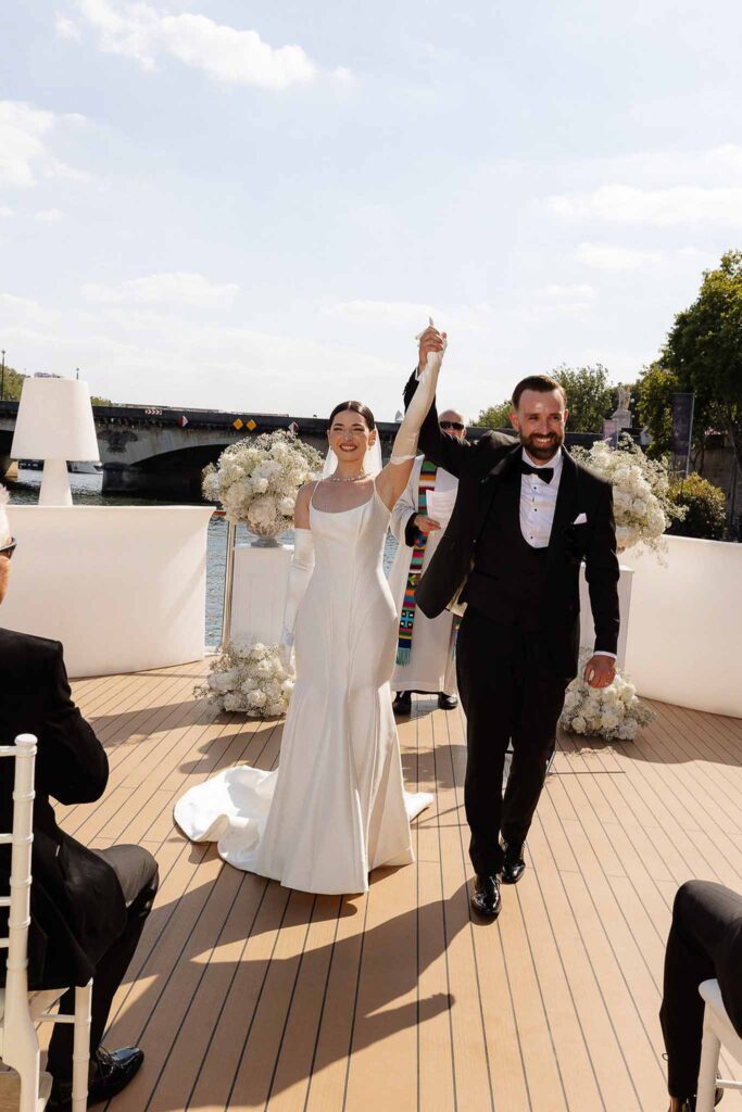 Boat in Paris Joan Jellet bride groom up hands ceremony boat