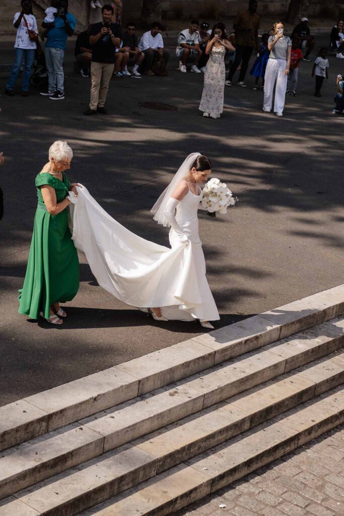 Boat in Paris Joan Jellet bride walking outside dock area long trail dress