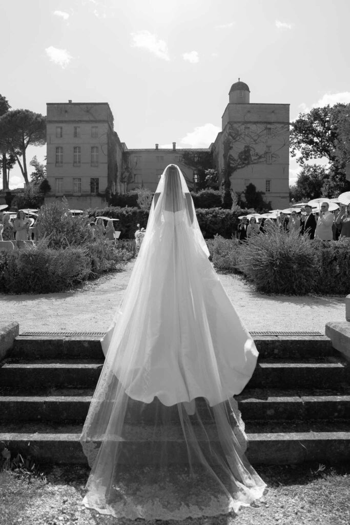 Chateau de Pondres Angie Graphy bride back shot long veil walking ceremony