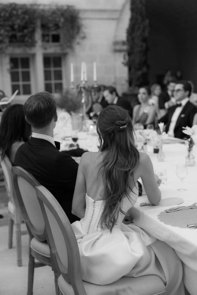 Chateau de Pondres Angie Graphy bride groom sitting reception table black white photo
