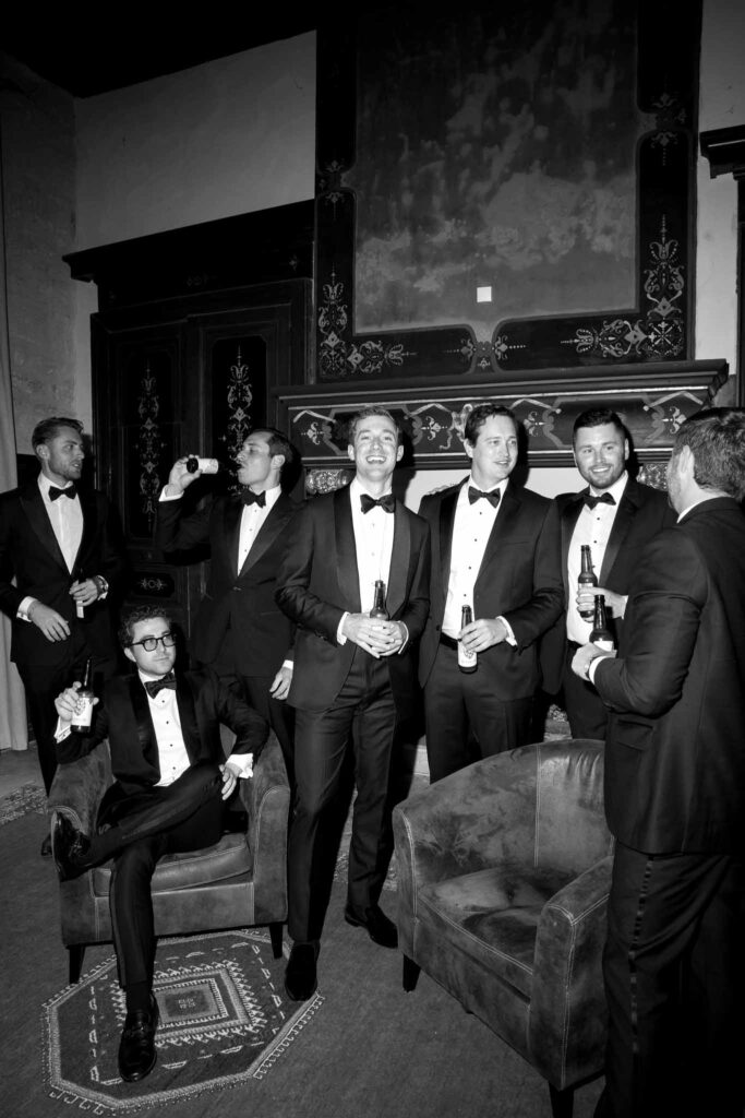 Chateau de Pondres Angie Graphy groom groomsmen get ready drinking beer