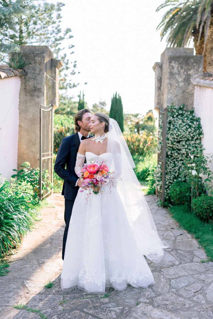 Domaine de Vignale Vincent Pennachio bride groom hugging from back kissing venue entrance