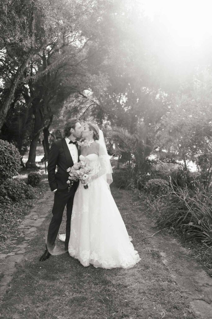 Domaine de Vignale Vincent Pennachio bride groom kissing sunlight garden