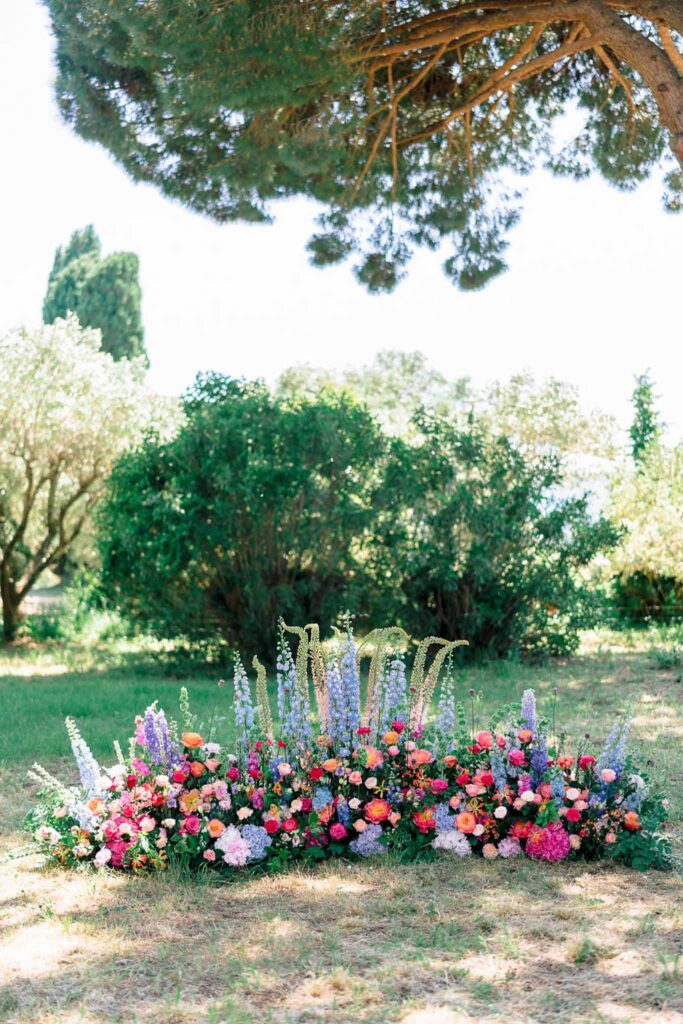 Domaine de Vignale Vincent Pennachio ceremony altar colorful flower arrangements