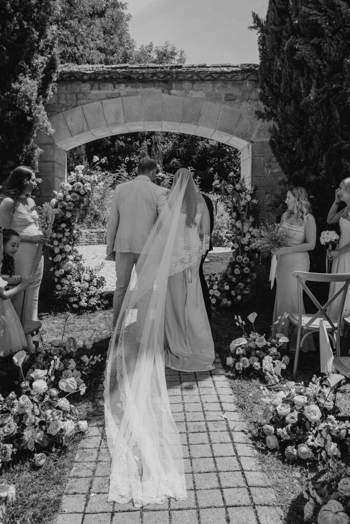 du Raysse W.Towell ceremony aisle bride walking backshot