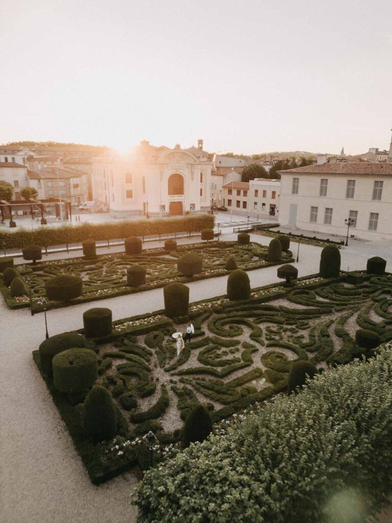 Castelet Suzy aerial shot golden hour couple holding umbrella landscape