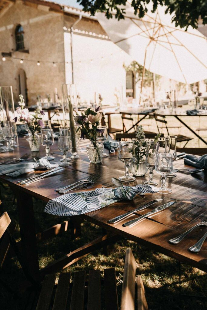 Castelet Suzy tablescape reception umbrella under tree