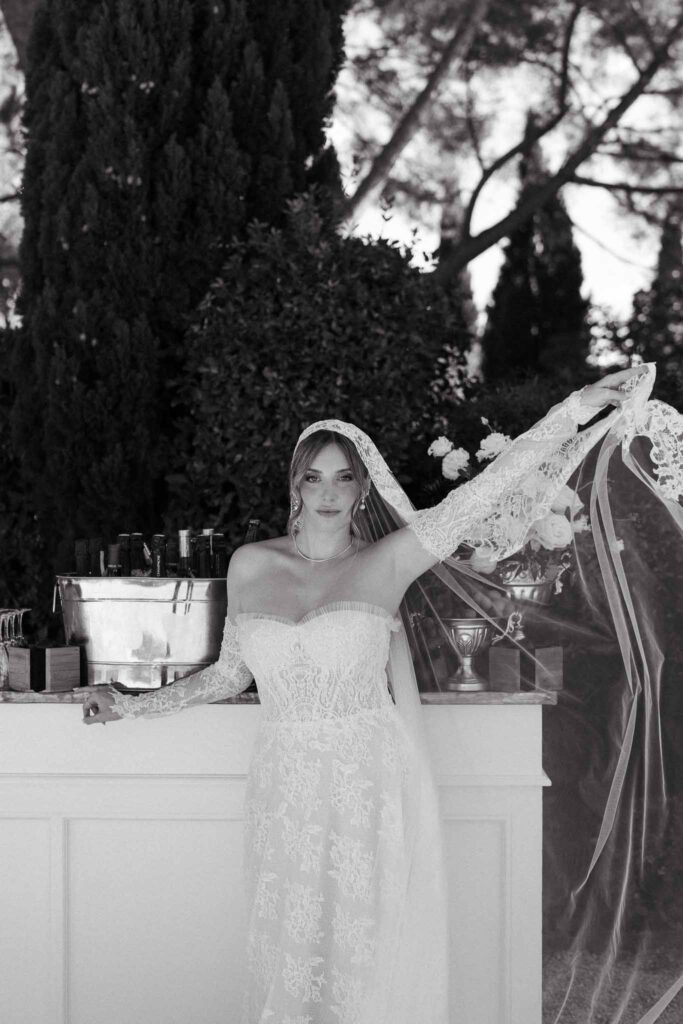 Tour Vaucros S.Rached bride lace dress posing cocktail bar