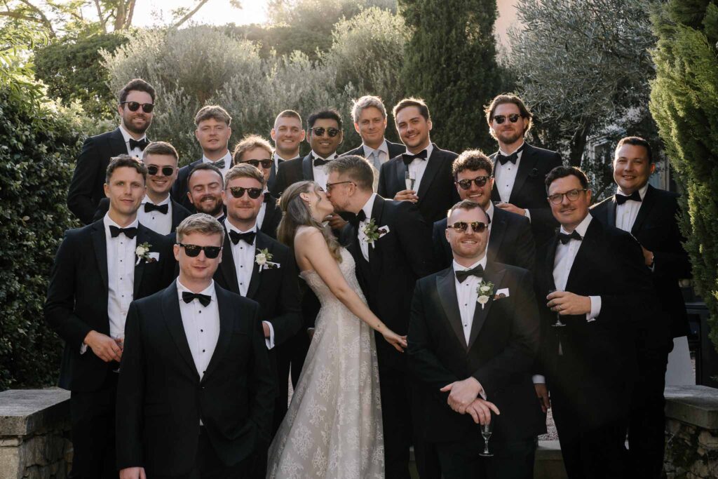 Tour Vaucros S.Rached couple kiss groomsmen formal picture