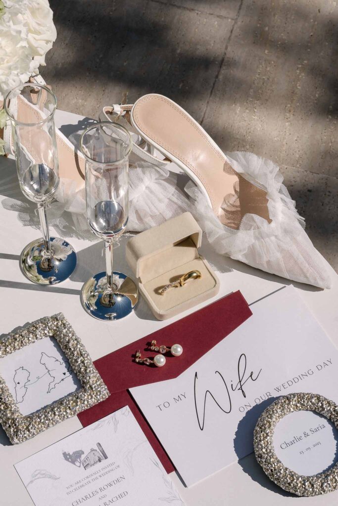 Tour Vaucros S.Rached flatlay accessories bride shoes invitation glass