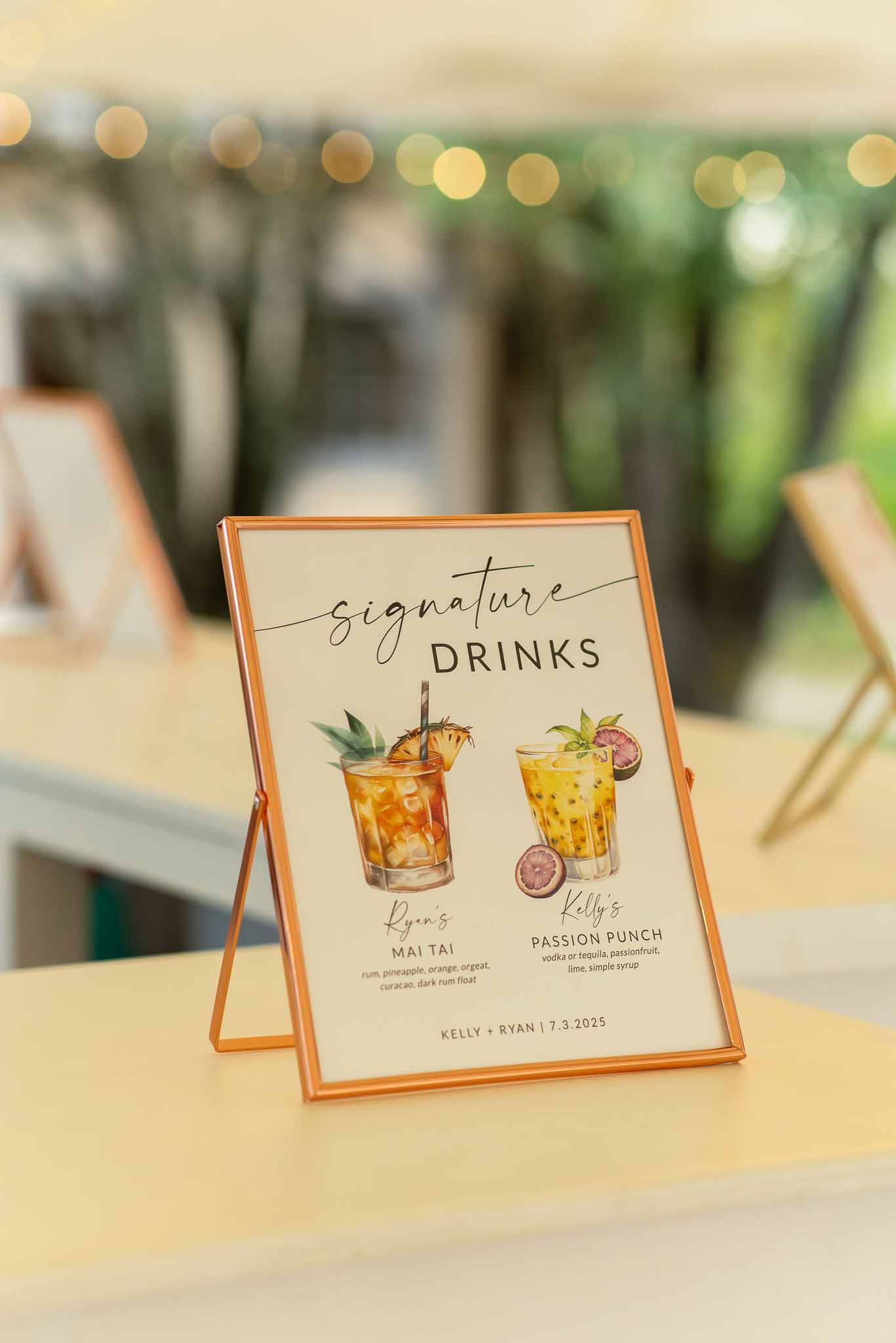 Signature cocktail menu sign in copper frame with watercolor illustrations of Mai Tai and Passion Punch
